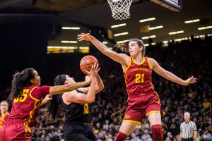 Iowa State guard Bridget Carleton #21 tries to block the shot of Iowa forward Megan Gustafson #10 during a womens basketball game against The University of Iowa at Carver-Hawkeye Arena on Wednesday, Dec. 5, 2018. The Hawkeyes defeated the Cyclones 73-70. 