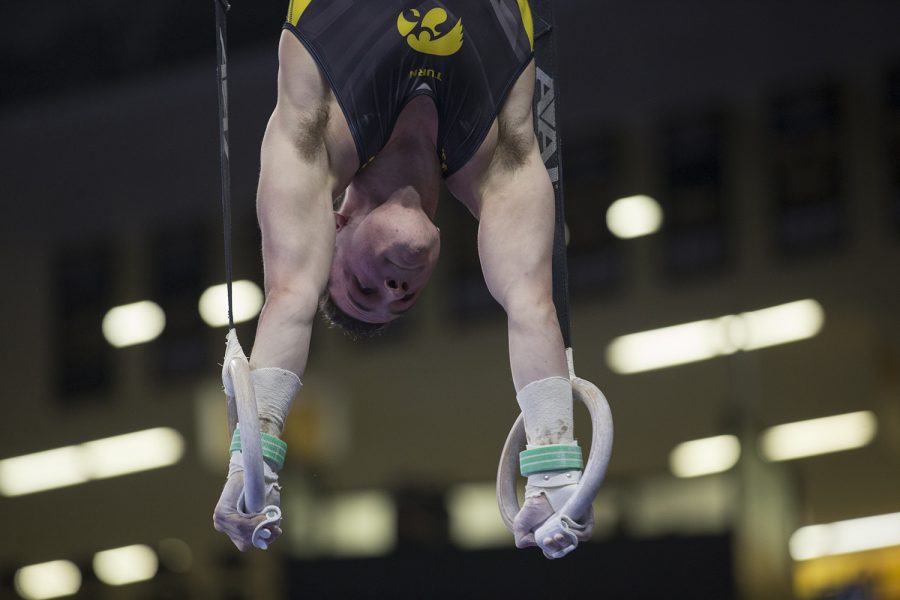 Jake Brodarzon competes on the rings during mens gymnastics Iowa vs. Nebraska at Carver Hawkeye Arena on Feb. 23, 2018.