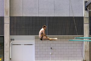 Iowa diver Anton Hoherz dives off the three-meter board in the preliminary diving rounds of the Hawkeye Invitational on Thursday, Nov. 15, 2018. (David Harmantas/The Daily Iowan)