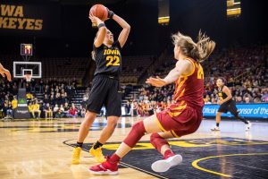 Iowa guard Kathleen Doyle #22 looks to shoot after driving back Iowa State guard Ashley Joens #24 during a womens basketball game against Iowa State University at Carver-Hawkeye Arena on Wednesday, Dec. 5, 2018. The Hawkeyes defeated the Cyclones 73-70. 