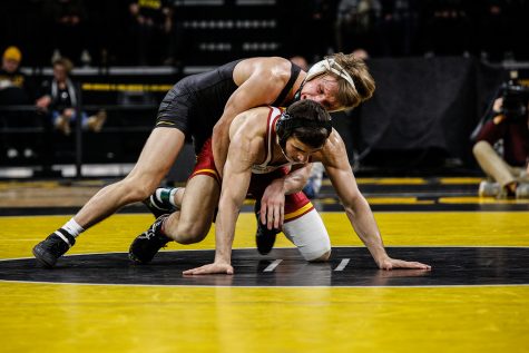 Iowas Max Murin wrestles Iowa States Ian Parker during Iowas dual meet against Iowa State at Carver-Hawkeye Arena in Iowa City on Saturday, Dec. 1, 2018. Parker defeated Murin 5-4. Iowa defeated the Cyclones 19-18.