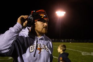 Volunteer Coach Jake Hulett watches the Orioles play the Central City Wildcats on Friday, Oct. 19, 2018. The Wildcats defeated the Orioles 63-22 in the rivalry game dubbed The Tractor Bowl and regained ownership of the heralded Tractor Bowl trophy. 