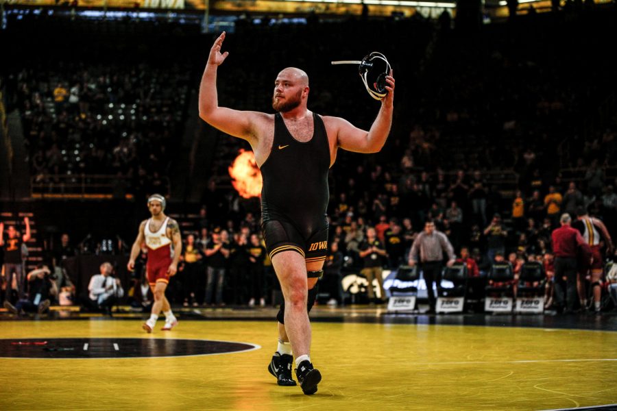 Sam Stoll celebrates his victory during Iowas dual meet against Iowa State at Carver-Hawkeye Arena in Iowa City on Saturday, December 1, 2018. Stoll defeated Gremmel 5-1. Iowa defeated the Cyclones 19-18. 
