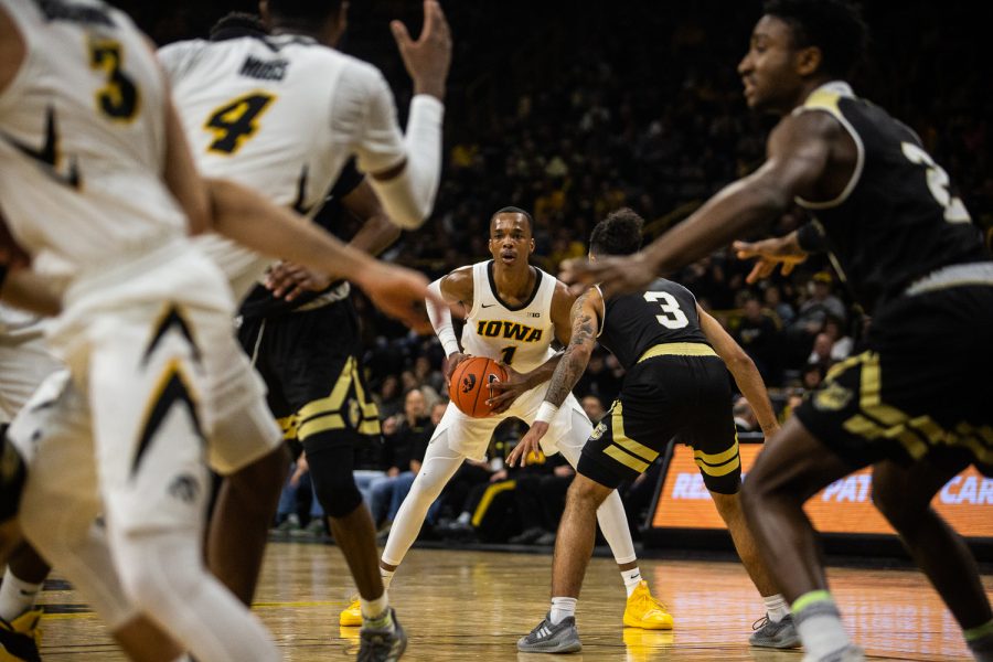 Iowa guard Maishe Dailey scans the floor during the mens basketball game against Bryant University on Saturday, December 29, 2018.. The Hawkeyes defeated the Bulldogs 72-67. (Wyatt Dlouhy/The Daily Iowan)