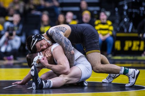 Iowas Pat Lugo wrestles Lehighs Jimmy Hoffman during a wrestling dual-meet between Iowa and Lehigh at Carver-Hawkeye Arena on Saturday, Dec. 8, 2018. Lugo, who is ranked tenth at 149, defeated Hoffman 12-3, as the Hawkeyes defeated the Mountain Hawks, 28-14. 