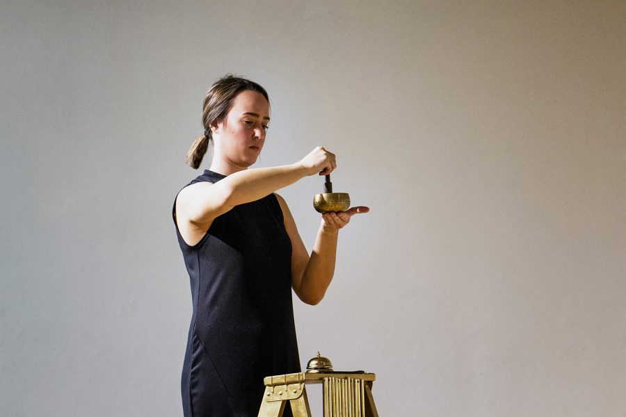 UI intermedia graduate student, Melissa Airy, performs in her live performance piece, "Sacra Mundanam" in Art Building West on Thursday, November 29, 2018. Airy dedicates her artwork to show how the Camino de Santiago, a 500-mile pilgrimage across Spain, impacted her life personally and as an artist. In "Sacra Mundanam," Airy shows how regular activities hold a sacredness on the pilgrimage.