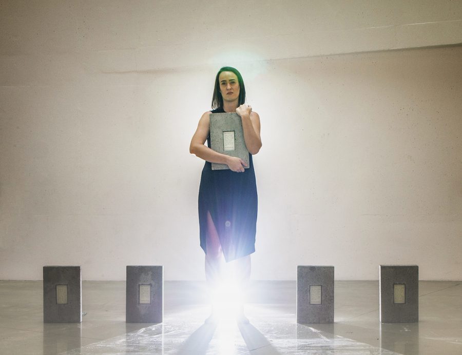 UI intermedia graduate student, Melissa Airy, holds a stone that is part of her series, "Dear Pilgrim, Thank You," in the Visual Arts Building on Friday, November 16, 2018. Airy dedicates her artwork to show how the Camino de Santiago, a 500-mile pilgrimage across Spain, impacted her life personally and as an artist.