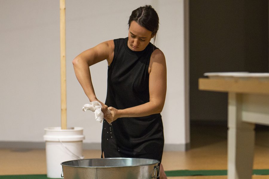 UI intermedia graduate student, Melissa Airy, performs in her live performance piece, "Sacra Mundanam" in Art Building West on Thursday, November 29, 2018. Airy dedicates her artwork to show how the Camino de Santiago, a 500-mile pilgrimage across Spain, impacted her life personally and as an artist. In "Sacra Mundanam," Airy shows how regular activities hold a sacredness on the pilgrimage.