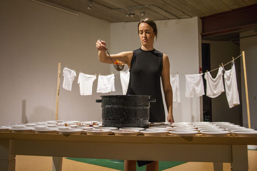 UI intermedia graduate student, Melissa Airy, performs in her live performance piece, "Sacra Mundanam" in Art Building West on Thursday, November 29, 2018. Airy dedicates her artwork to show how the Camino de Santiago, a 500-mile pilgrimage across Spain, impacted her life personally and as an artist. In "Sacra Mundanam," Airy shows how regular activities hold a sacredness on the pilgrimage. 