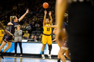 Guard Tania Davis attempts a three-pointer during the womens basketball game at Carver Hawkeye Arena on Dec. 2, 2018. The Hawkeyes won against Robert Morris 92-63. 