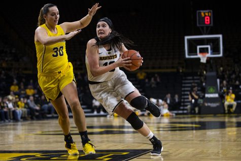 Iowa forward Megan Gustafson drives to the basket during the Iowa/Michigan womens basketball game at Carver-Hawkeye Arena on Thursday, January 17, 2019. The Hawkeyes defeated the Wolverines, 75-61. (Lily Smith/The Daily Iowan)