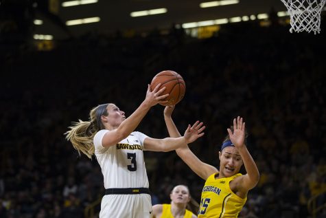 Iowa guard Makenzie Meyer attempts a layup during the Iowa/Michigan womens basketball game at Carver-Hawkeye Arena on Thursday, January 17, 2019. The Hawkeyes defeated the Wolverines, 75-61. 