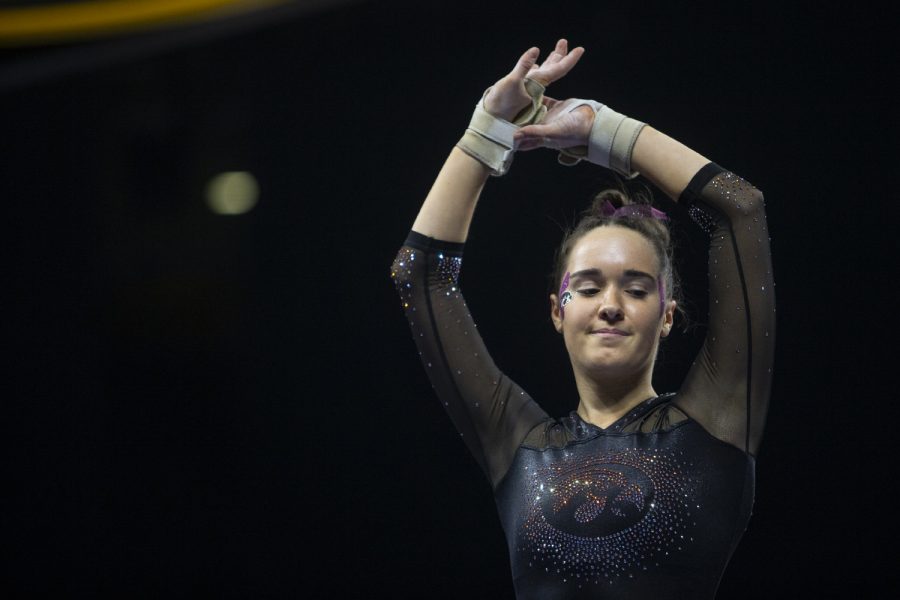 Allie Gilchrist performs on the balance beam during the womens gymnastic meet against the University of Minnesota on Saturday, January 19, 2019. The Gophers defeated the Hawkeyes 195.475- 194.350. Gilchrist got a 9.725 on the balance beam. 