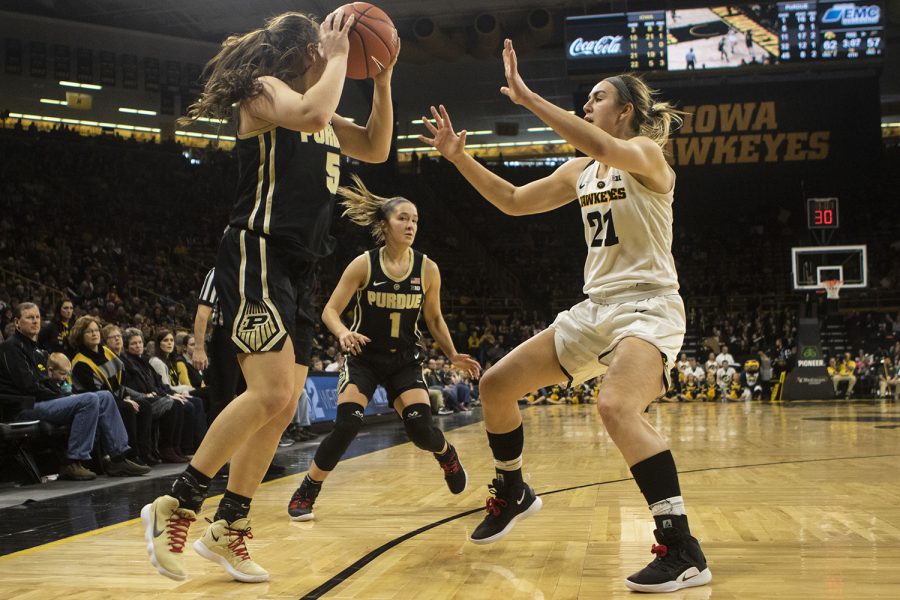 Iowa forward Hannah Stewart guards Purdue guard Cassidy Hardin during the Iowa/Purdue womens basketball game at Carver-Hawkeye Arena on Sunday, January 27, 2019. The Hawkeyes defeated the Boilermakers, 72-58. 