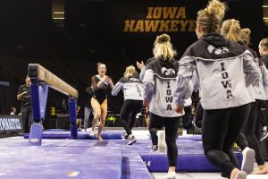Iowa Gymnast Allie Gilchrist celebrates with her team during a gymnastics meet against Rutgers on Saturday, Jan. 26, 2019. The Hawkeyes defeated the Scarlet Knights 194.575 to 191.675. 