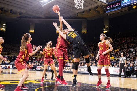 Iowa forward Megan Gustafson tries to block a shot during a womens basketball game against Iowa State University at Carver-Hawkeye Arena on Wednesday, Dec. 5, 2018. The Hawkeyes defeated the Cyclones 73-70. 