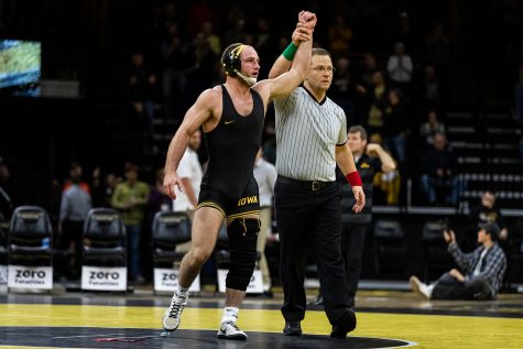 Iowas No. 4 ranked Alex Marinelli celebrates defeating Princetons Dale Tiongson in a 165-pound wrestling match at Carver-Hawkeye Arena on Friday, Nov. 16, 2018. 