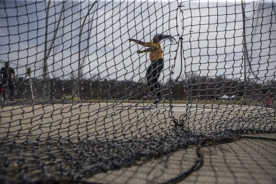 Iowa sophomore Laulauga Tausaga attempts a discus throw during the 19th annual Musco Twilight meet at the Francis X. Cretzmeyer Track in Iowa City on Thursday, April 12. Tausaga finished first in the event with a distance of 56.69 meters.