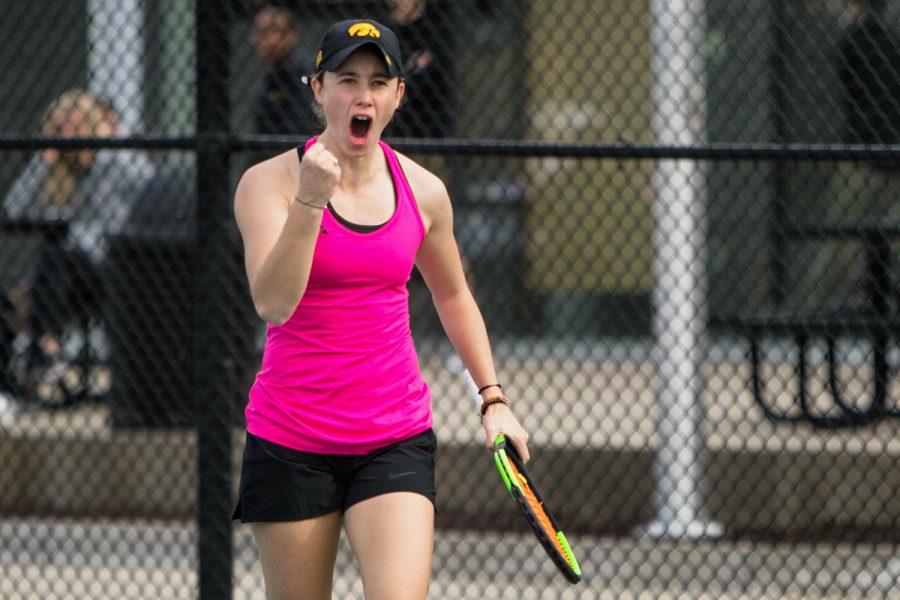 Elise van Heuvelen celebrates during Iowa's meet against Minnesota at the HTRC on April 20, 2018.The Hawkeyes were defeated 4-3. 