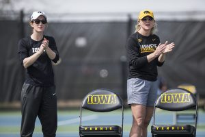 Iowa head coach Sasha Schmid and strength coach Lindsay Winkelman cheer on the Hawks during the match against Penn State at Hawkeye Tennis and Recreation Complex on Sunday, April 9. 
