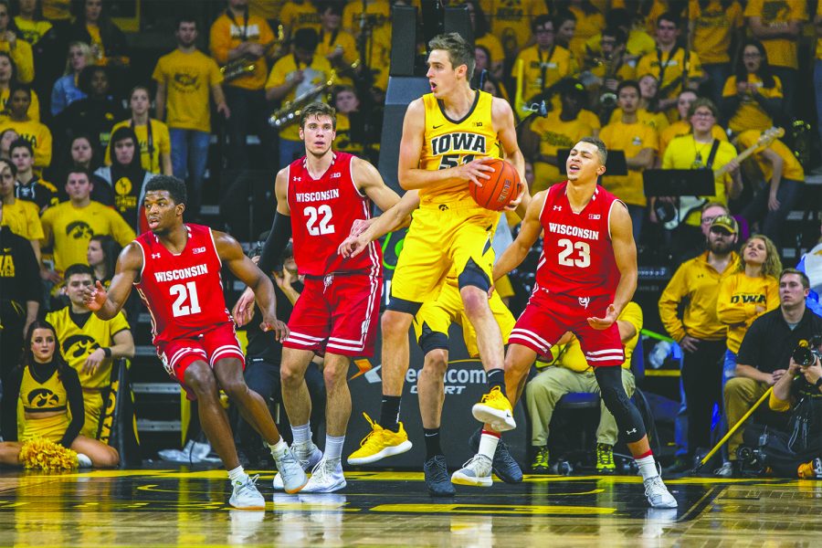 Iowa forward Nicholas Baer intercepts a pass during Iowa's game against Wisconsin at Carver-Hawkeye Arena on November 30, 2018. The Hawkeyes were defeated by the Badgers 72-66.