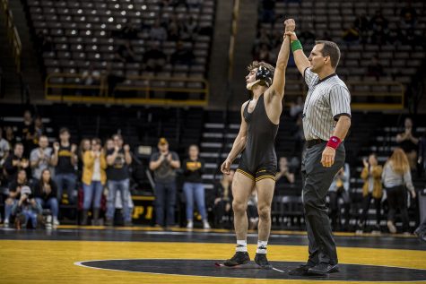 Iowas Austin DeSanto reacts to his victory during Iowas dual meet against Purdue at Carver-Hawkeye Arena in Iowa City on Saturday, November 24, 2018. DeSanto defeated Thornton 5-2. The Hawkeyes defeated the Boilermakers 26-9.