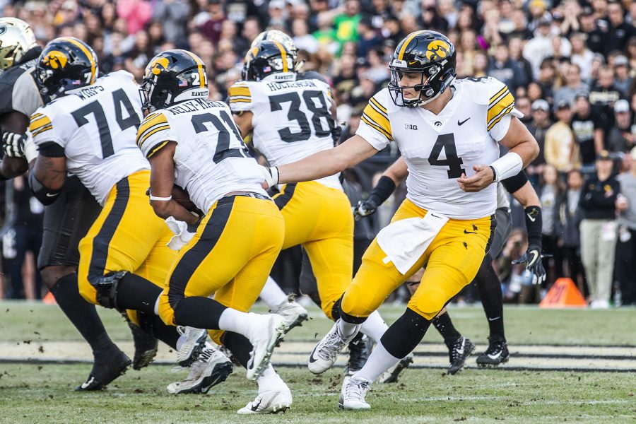 Iowa quarterback Nate Stanley hands the ball off to Iowa running back Ivory Kelly-Martin during the Iowa/Purdue game at Ross-Ade Stadium in West Lafayette, Indiana on Saturday, Nov. 3, 2018. The Boilermakers defeated the Hawkeyes 38-36. 