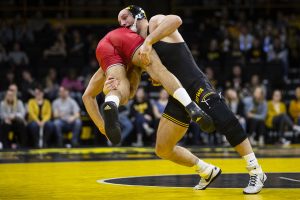 Iowas #2 Alex Marinelli wrestles Rutgers Anthony Oliveri during the Iowa/Rutgers wrestling meet at Carver-Hawkeye Arena on Friday, January 18, 2019. Marinelli defeated Oliveri, 6-0.The Hawkeyes defeated the Scarlet Knights, 30-6. 