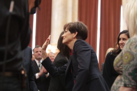 Julia Shanahan. Iowa Gov. Kim Reynolds waves on the Iowa House floor after she finished her Condition of the State address Jan. 15.