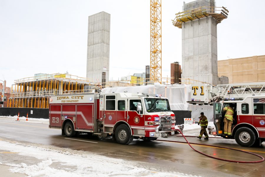 Members of the Iowa City Fire Department respond to a fire at a construction site at the corner of Burlington and Clinton in Iowa City on Monday, January 21, 2019. (David Harmantas/The Daily Iowan)