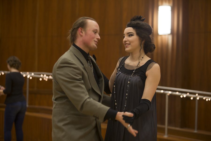 A couple dancing and dressed in 1920s style clothing at the Swing Dance Clubs Gatsby Dance on Jan. 26 at the IMU.