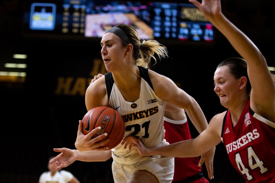 Iowa forward Hannah Stewart #21 rebounds a ball late in the fourth quarter in a women's basketball game against the Nebraska Huskers at Carver-Hawkeye Arena on Thursaday January 3, 2018. The Hawkeyes beat the Huskers, 77-71. (Roman Slabach/The Daily Iowan)