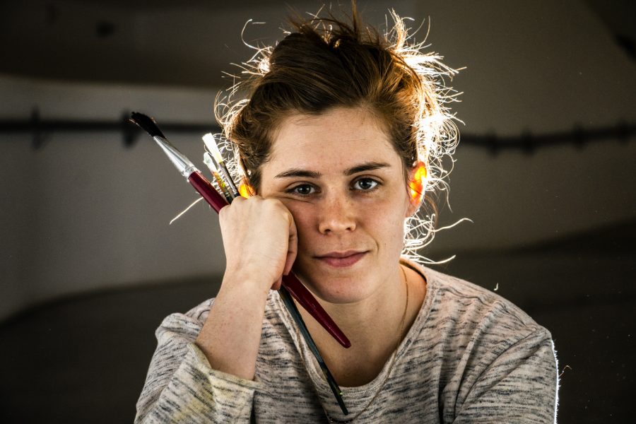 UI graduate student Claire Whitehurst poses for a portrait in the Visual Arts Building on Tuesday, January 15, 2019. "I paint about dreams and the real world through observation," Whitehurst said. "I dream a lot of shapes." (Katina Zentz/The Daily Iowan)