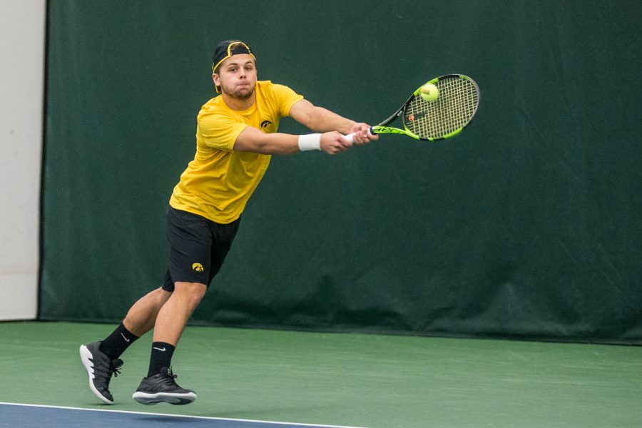 Iowas Will Davies hits a backhand during a mens tennis matchup between Iowa and Butler on Sunday, January 27, 2019. The Hawkeyes defeated the Bulldogs, 5-2.