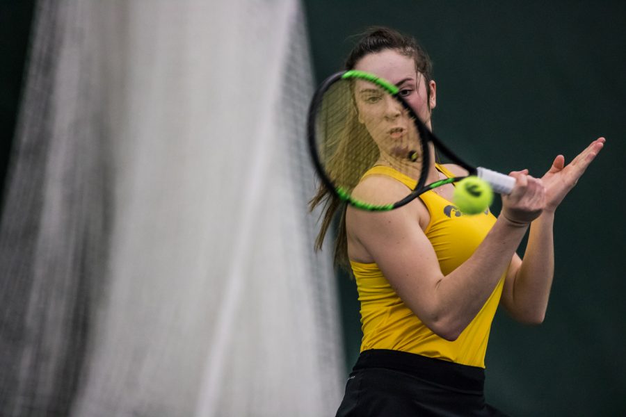 Iowas Samantha Mannix hits a forehand during a womens tennis match between Iowa and Xavier at the Hawkeye Tennis and Recreation Center on Friday, January 18, 2019. The Hawkeyes swept the Musketeers, 7-0.