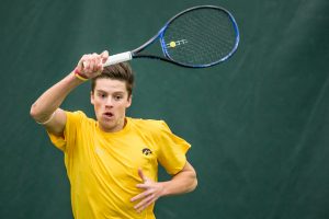 Iowa's Joe Tyler hits a forehand during a men's tennis matchup between Iowa and Butler on Sunday, January 27, 2019. The Hawkeyes defeated the Bulldogs, 5-2.