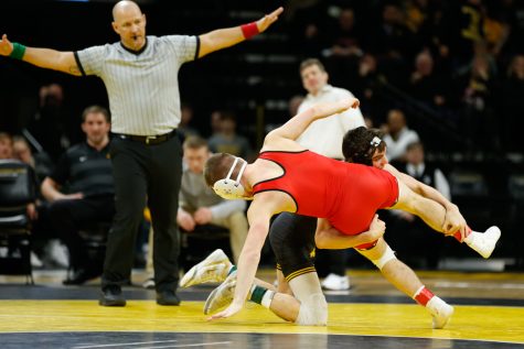 Iowa Wrestler Paul Glynn grapples with Maryland Wrestler Orion Anderson in the 133lb weight class match during a wrestling dual meet at Carver-Hawkeye Arena on Friday, Feb. 8, 2019. Glynn won via pin at 1:46 and the Hawkeyes defeated the Terrapins 48-0.