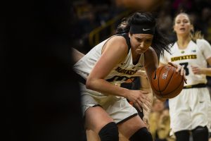 Iowa center Megan Gustafson drives to the basket during the Iowa/Illinois womens basketball game at Carver-Hawkeye Arena on Thursday, February 14, 2019. The Hawkeyes defeated the Fighting Illini, 88-66. 