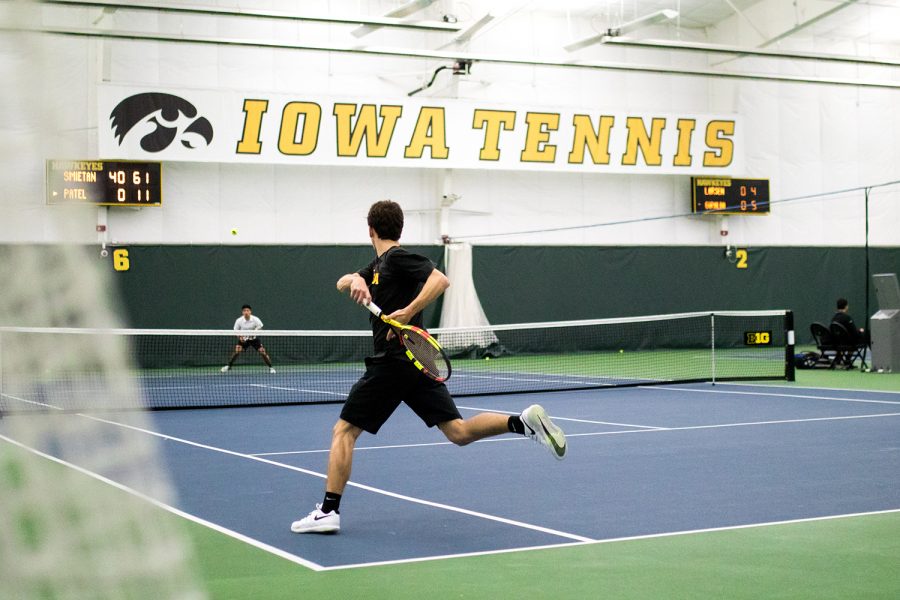 Iowas Piotr Smietana hits a forehand during a mens tennis match between Iowa and UMKC at the HTRC on Friday, February 15, 2019. The Hawkeyes defeated the Kangaroos, 4-3. 