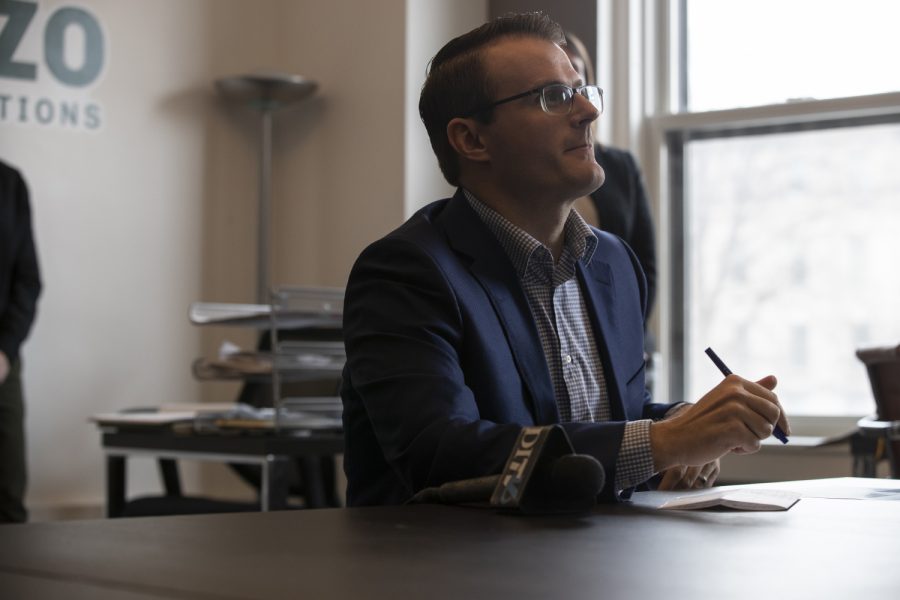 Adam Gregg takes notes during his visit with Rantizo in downtown Iowa City on Feb. 25, 2019. 