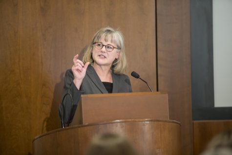 Professor Karen Heimer speaks during the 36th Annual Presidential Lecture at the Levitt Center in Iowa City on Sunday, Feb. 24, 2019. Heimer was speaking about her research on violence against women in the United States. 