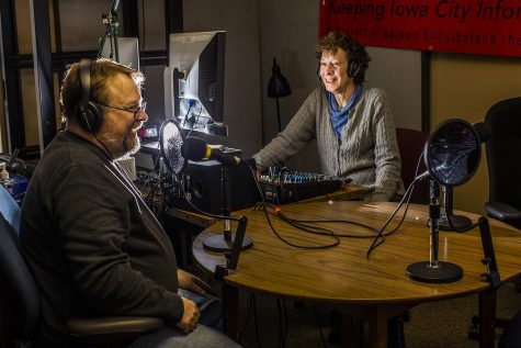 Station Producer Craig Jarvie and Station Manager Holly Hart talk to each other in the KICI studio on Wednesday, February 20, 2019. (Katina Zentz/The Daily Iowan)