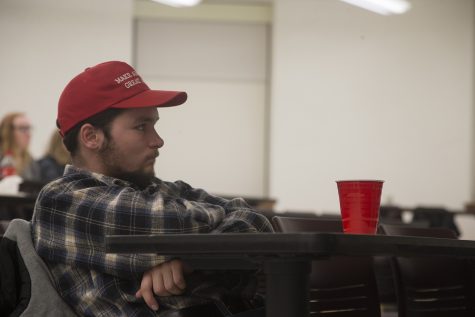 An attendee watches at a College Republicans watch party for the State of the Union address in Shaeffer Hall on Tuesday, February 5, 2019.