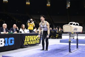 Iowa gymnast Bennet Huang celebrates after dismounting the pommel horse during a gymnastics meet against Minnesota and Illinois-Chicago on Saturday, Feb 2, 2019. The Golden Gophers won the meet with a total score of 406.400 with the Hawkeyes scoring 401.600 and the Flames scoring 355.750. 