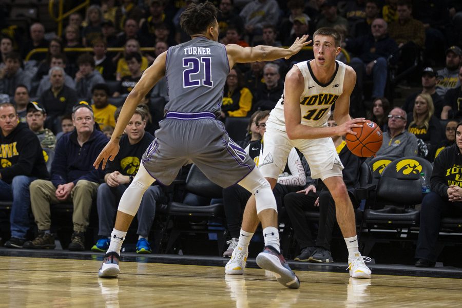 Iowa+guard+Joe+Wieskamp+looks+to+pass+the+ball+during+the+Iowa%2FNorthwestern+mens+basketball+game+at+Carver-Hawkeye+Arena+on+Sunday%2C+February+10%2C+2019.+The+Hawkeyes+defeated+the+Wildcats%2C+80-79.+%28Lily+Smith%2FThe+Daily+Iowan%29