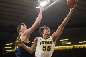 Iowa forward Luka Garza attempts a shot during the Iowa/Michigan mens basketball game at Carver-Hawkeye Arena on Friday, February 1, 2019. The Hawkeyes took down the No. 5 ranked Wolverines, 74-59. 
