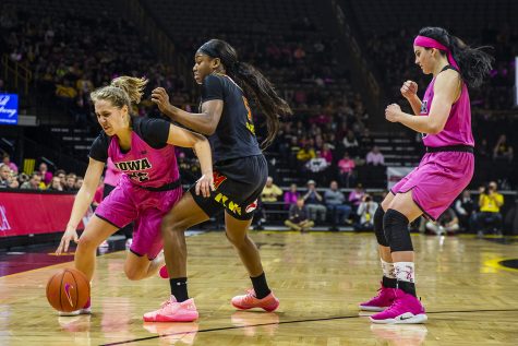 Iowa guard Kathleen Doyle dribbles past Maryland guard Kaila Charles during the womens basketball game vs. Maryland at Carver-Hawkeye Arena on Sunday, February 17, 2019. The Hawkeyes defeated the Terrapins 86-73. 