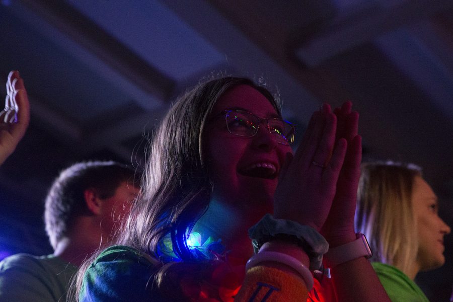 A morale captain assistant cheers on families as they arrive onstage during Dance Marathon 25 at the Iowa Memorial Union on Friday, Feb. 1, 2019.