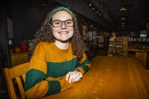 UI junior Ella McDonald poses for a portrait at Java House on Monday, February 11, 2019. McDonald started the Half Caff podcast with coworker Jack Berning about living the life of a barista. (Katina Zentz/The Daily Iowan)