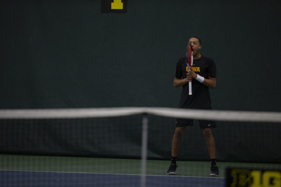 Oliver Okonkwo celebrates a point during the Men's tennis match against University of Miami at the Hawkeye Tennis and Recreation Complex on Feb. 8, 2019. Okonkwo won his singles match against Dane Dunlap. Miami defeated Iowa 4-1. 